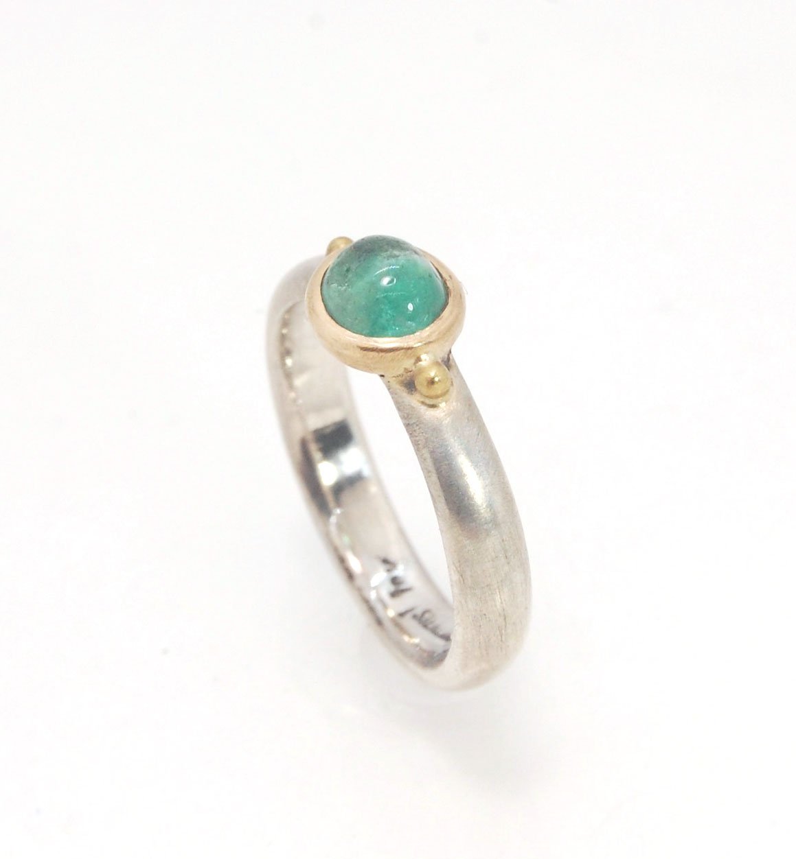 Emerald Bi Metal Freckle Ring - 14k and Sterling Silver - Size 8 This is a unique emerald cabochon with a darker freckle included in the lighter-colored emerald! This emerald cabochon is bezel-set in 14k gold with large gold granules on the Sterling Silve