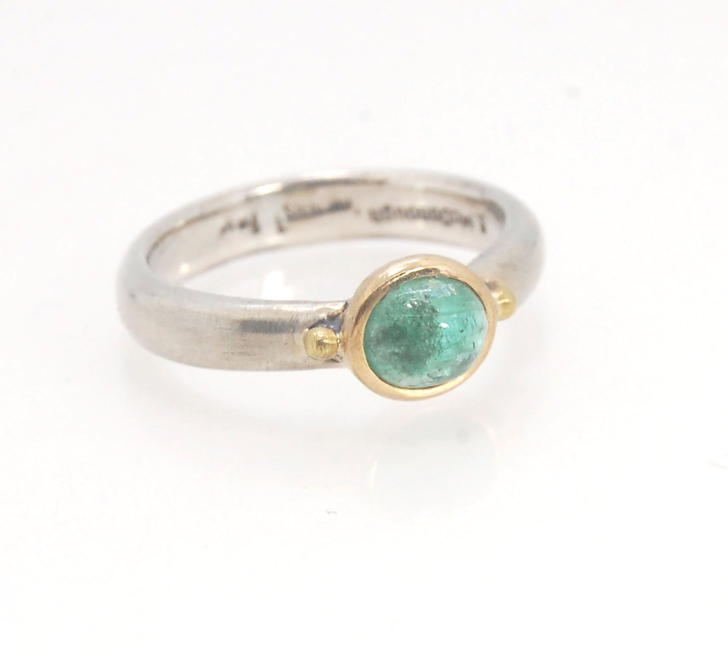 Emerald Bi Metal Freckle Ring - 14k and Sterling Silver - Size 8 This is a unique emerald cabochon with a darker freckle included in the lighter-colored emerald! This emerald cabochon is bezel-set in 14k gold with large gold granules on the Sterling Silve