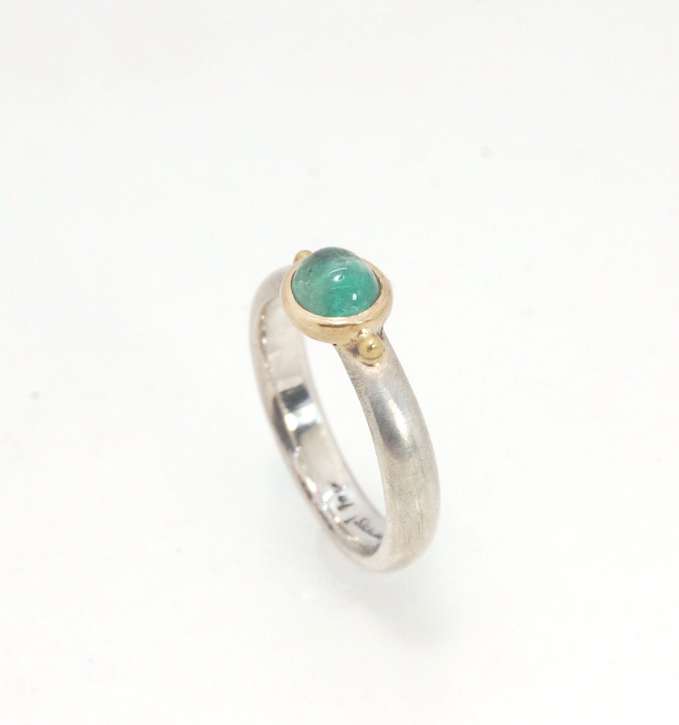 Emerald Bi Metal Freckle Ring - 14k and Sterling Silver - Size 8 This is a unique emerald cabochon with a darker freckle included in the lighter-colored emerald! This emerald cabochon is bezel-set in 14k gold with large gold granules on the Sterling Silve