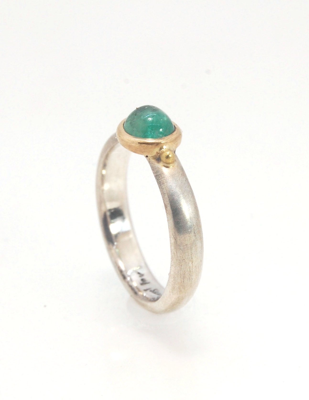 Emerald Bi Metal Freckle Ring - 14k and Sterling Silver - Size 8 This is a unique emerald cabochon with a darker freckle included in the lighter-colored emerald! This emerald cabochon is bezel-set in 14k gold with large gold granules on the Sterling Silve