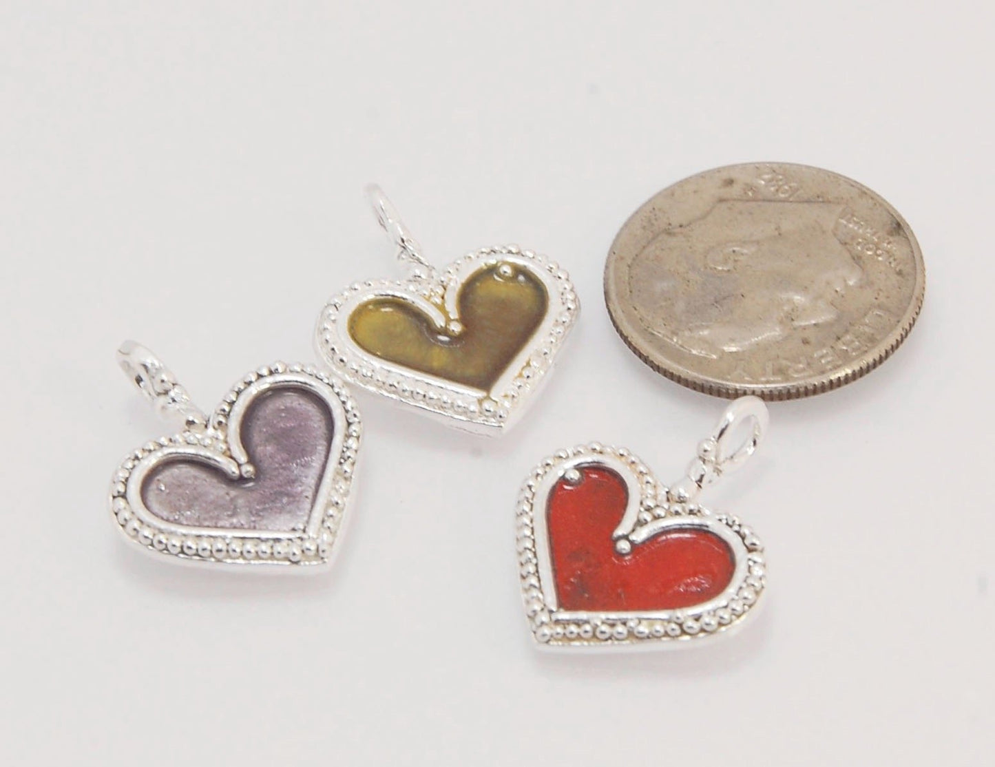 Enamel Heart Charm in Fine SIlver It’s a HEART of fine silver granulation that I made a mold of, then cast, then enameled! In your choice of colors: Red, Purple, Green, Black, Azalea, HollyhockGranulation is an ancient fusing process utilized for thousand