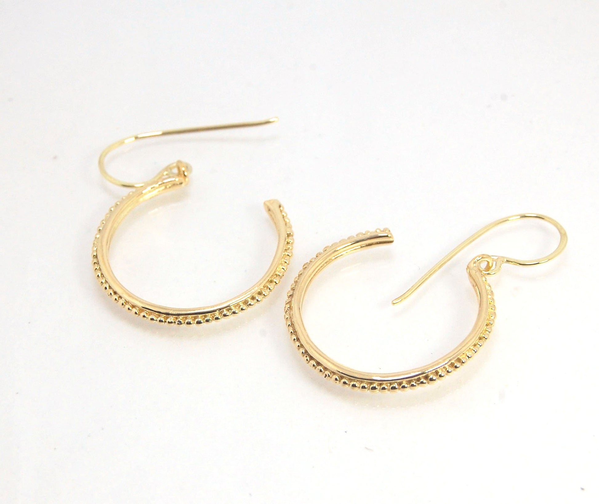 Etruscan hoop Dangles with French Hooks in 14k Gold - Large These 14k yellow gold hoops are cast in my studio from an original granulated master for a limited edition series of hoops. I use fine silver for the original granulation, then make a mold, pull