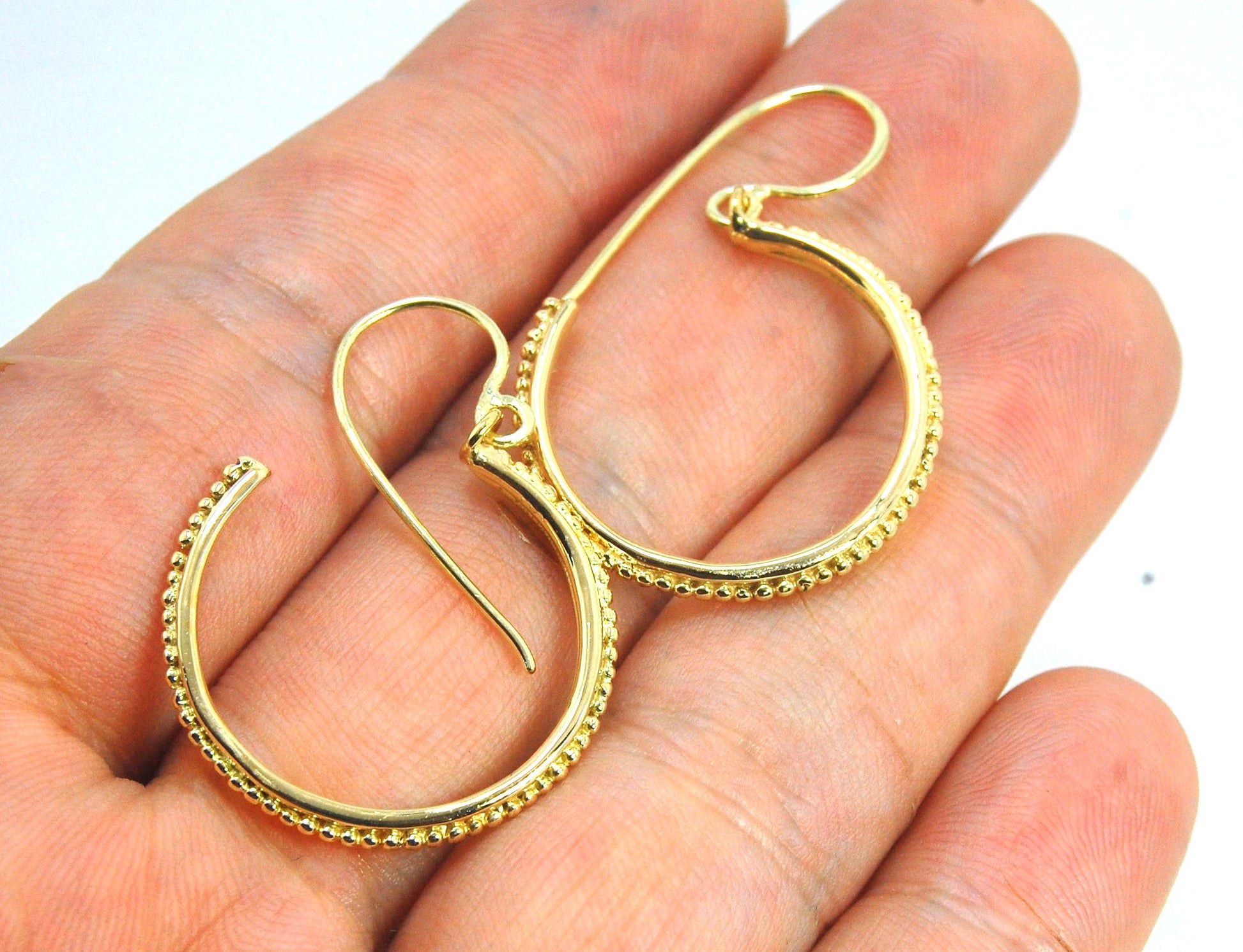 Etruscan hoop Dangles with French Hooks in 14k Gold - Large These 14k yellow gold hoops are cast in my studio from an original granulated master for a limited edition series of hoops. I use fine silver for the original granulation, then make a mold, pull