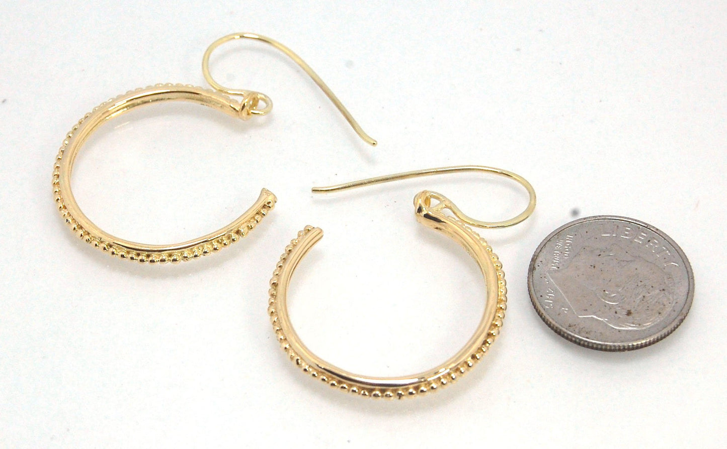 Etruscan hoop Dangles with French Hooks in 14k Gold - Large These 14k yellow gold hoops are cast in my studio from an original granulated master for a limited edition series of hoops. I use fine silver for the original granulation, then make a mold, pull