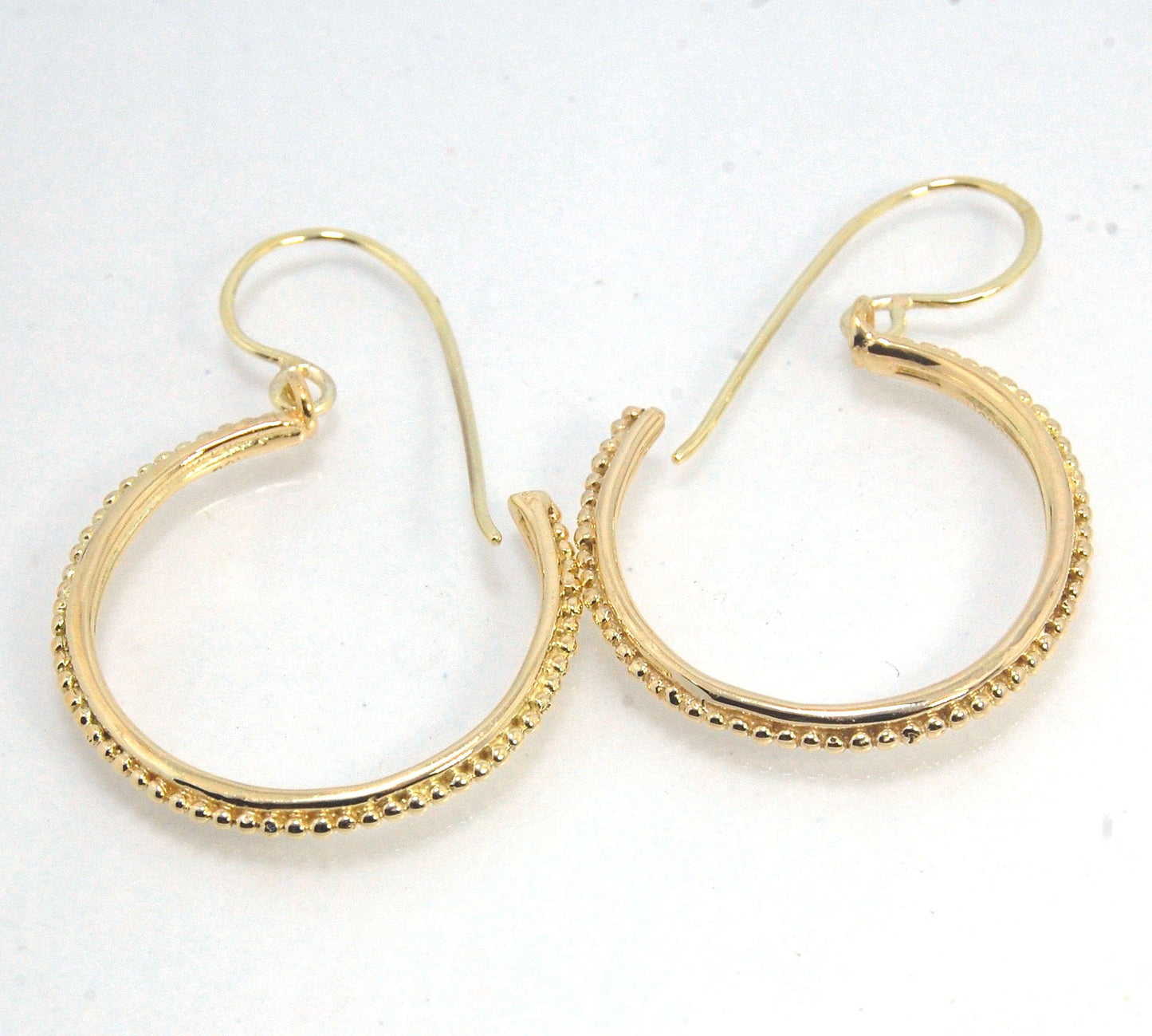 Etruscan hoop Dangles with French Hooks in 14k Gold - Large These 14k yellow gold hoops are cast in my studio from an original granulated master for a limited edition series of hoops. I use fine silver for the original granulation, then make a mold, pull