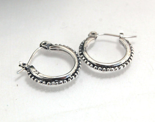 Etruscan hoops in Sterling Silver - xtraSmall Huggies These xtra small huggie hoops in sterling silver hoops are cast from a granulated master for a limited edition series of hoops and graze the bottom of your earlobe. I use fine silver for the original g