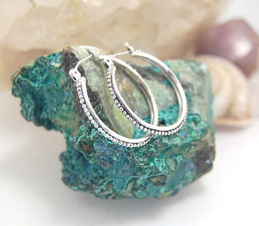 Etruscan Hoops in Sterling Silver - Large These sterling silver hoops are cast using the Lost Wax process from a granulated master for a limited edition series of hoops. I use fine silver for the original granulation, then make a mold, pull a wax copy fro