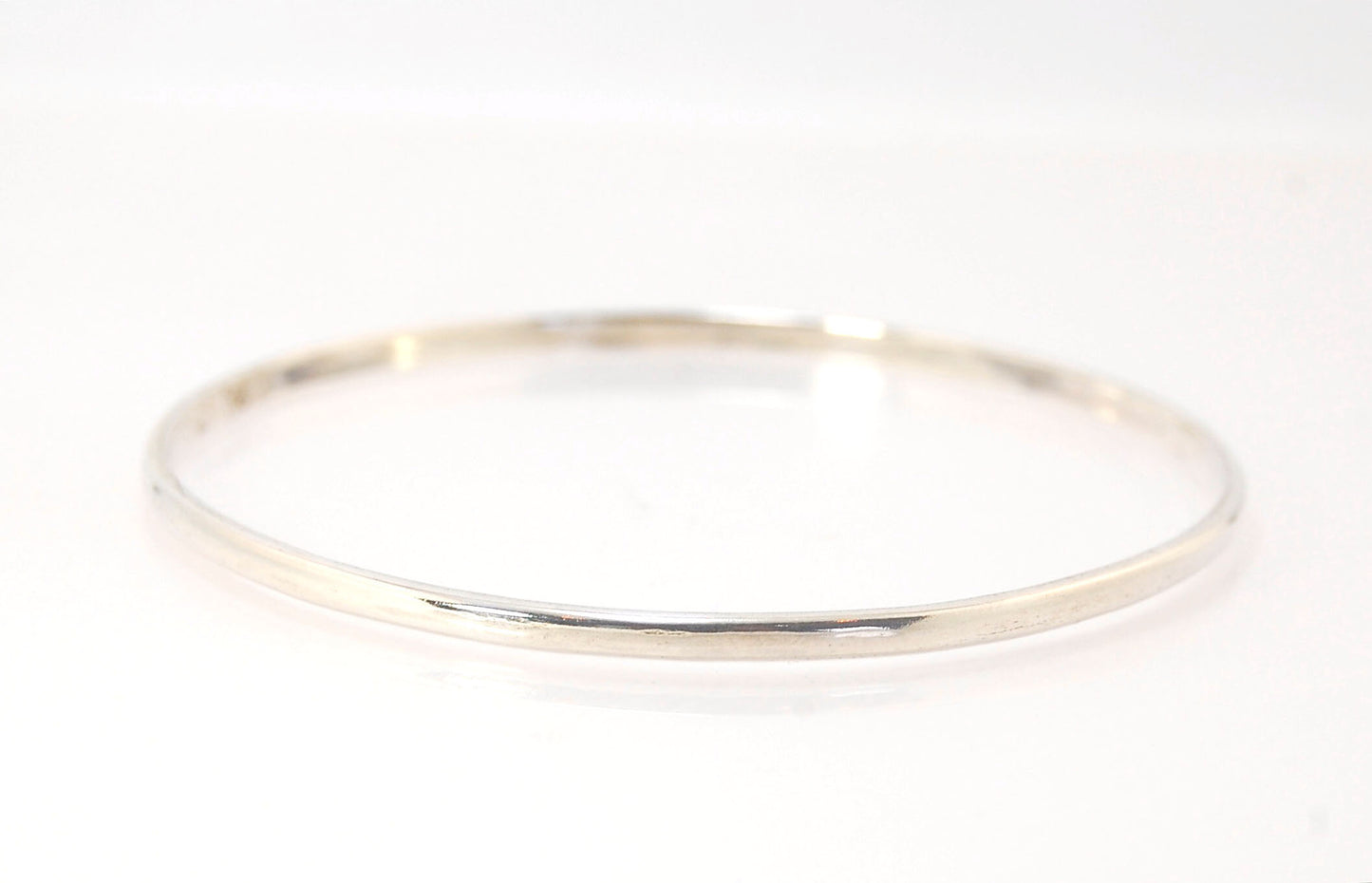 3mm Half Round Sterling Silver Bangles Who doesn’t love a good bangle stack! These bangles are available in 2 finishes. Shiny or Matte.Handmade by me in my studio, I pour a large ingot of sterling silver and roll it out into a half round shape and cut to