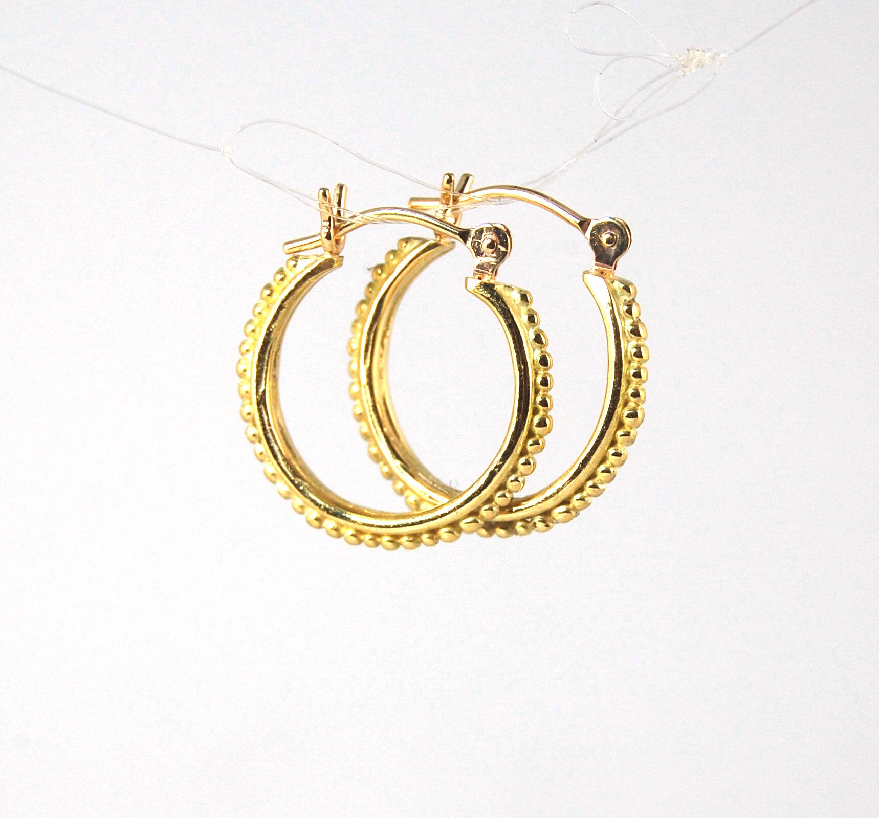 Light Etruscan Hoops in 14k gold - 15mm - lightweight These 14k yellow gold hoops are cast in my studio (actually on the deck as casting needs good ventilation) from a granulated master for a limited edition series of hoops. I use fine silver for the orig