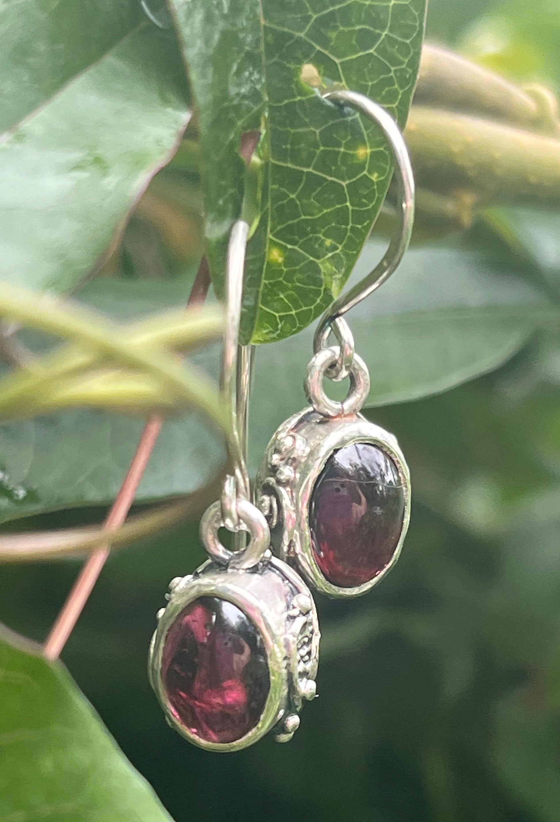 Oval Swirled Earrings with French Hooks in Sterling with your choice of Moonstone, Blue Chacedony, Amethyst, Rose Quartz, or Garnet These sweet swirled oval dangle earrings can be set with the stone of your choice: Moonstone, Blue Chacedony, Amethyst, Ros