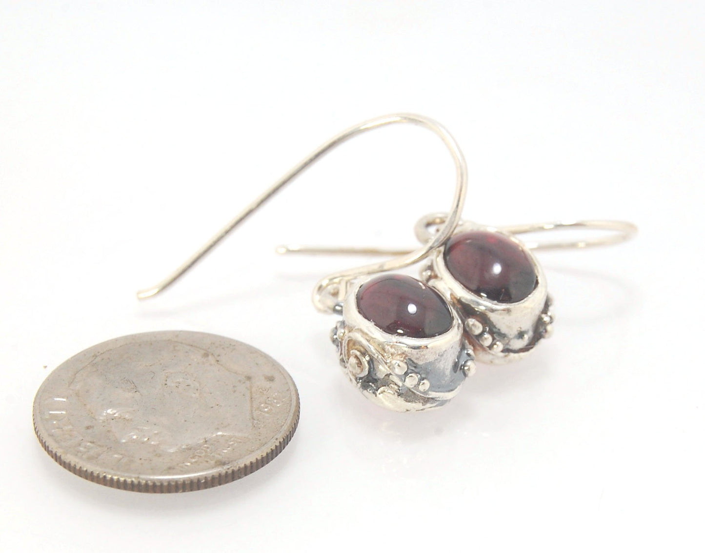 Oval Swirled Earrings with French Hooks in Sterling with your choice of Moonstone, Blue Chacedony, Amethyst, Rose Quartz, or Garnet These sweet swirled oval dangle earrings can be set with the stone of your choice: Moonstone, Blue Chacedony, Amethyst, Ros