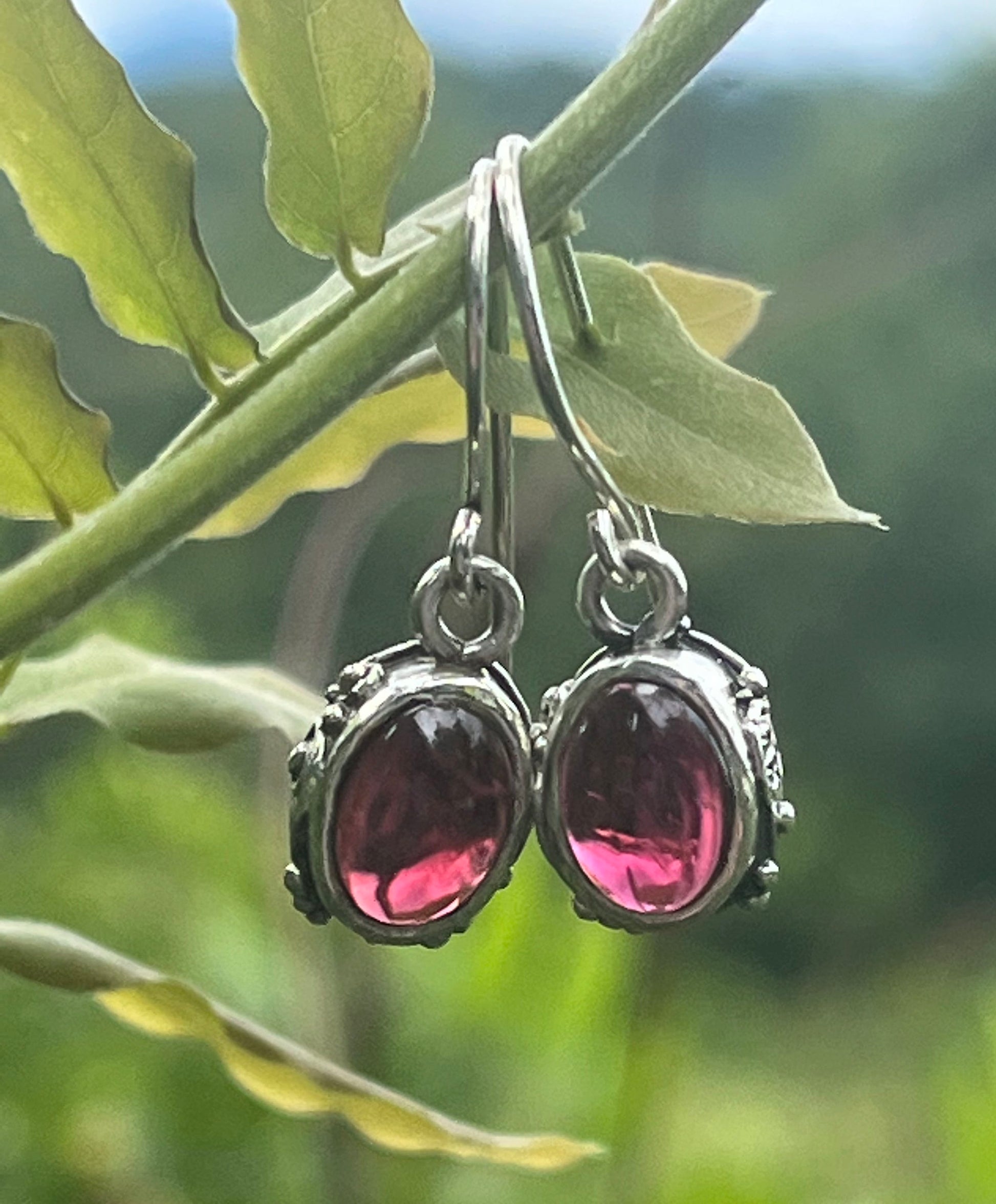 Oval Swirled Earrings with French Hooks in Sterling with your choice of Moonstone, Blue Chacedony, Amethyst, Rose Quartz, or Garnet These sweet swirled oval dangle earrings can be set with the stone of your choice: Moonstone, Blue Chacedony, Amethyst, Ros