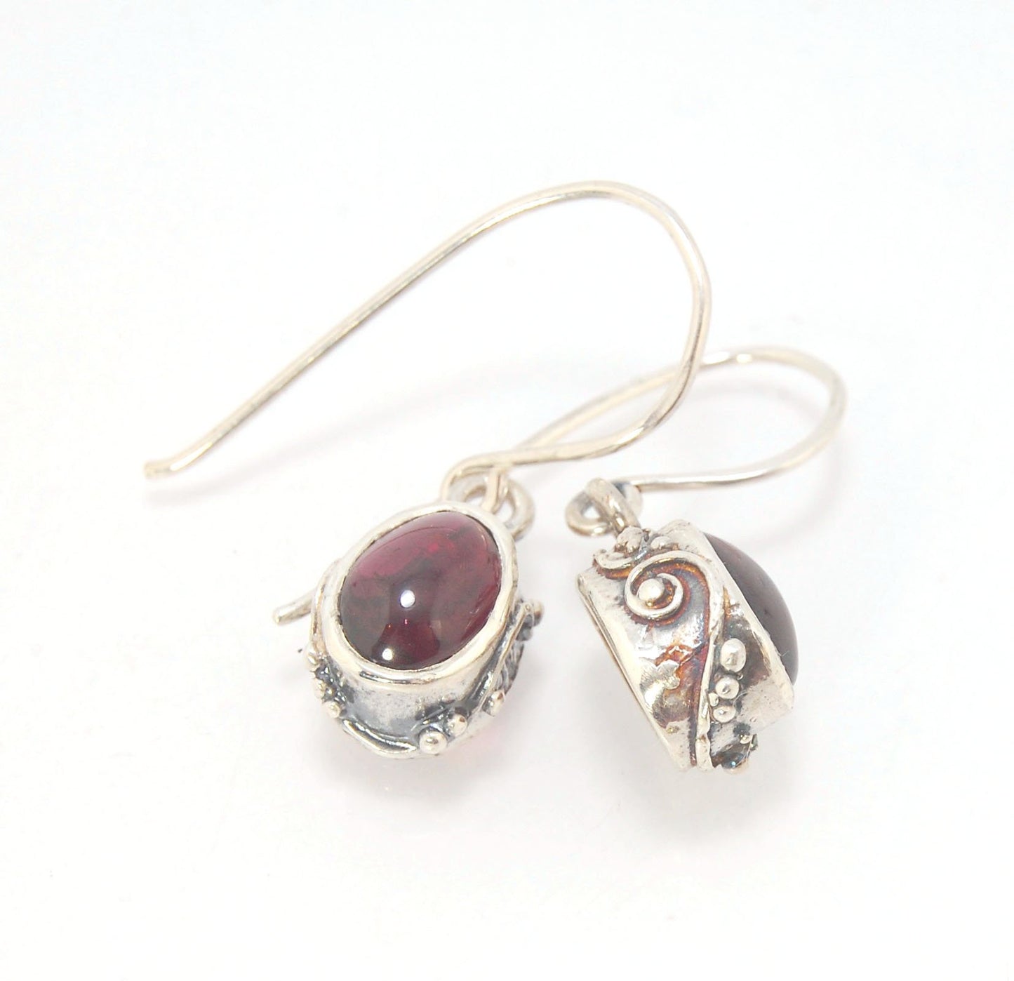 Oval Swirled Earrings with French Hooks in Sterling with your choice of Moonstone, Blue Chacedony, Amethyst, Rose Quartz, or Garnet These sweet swirled oval dangle earrings can be set with the stone of your choice: Moonstone, Blue Chacedony, Amethyst, Ros