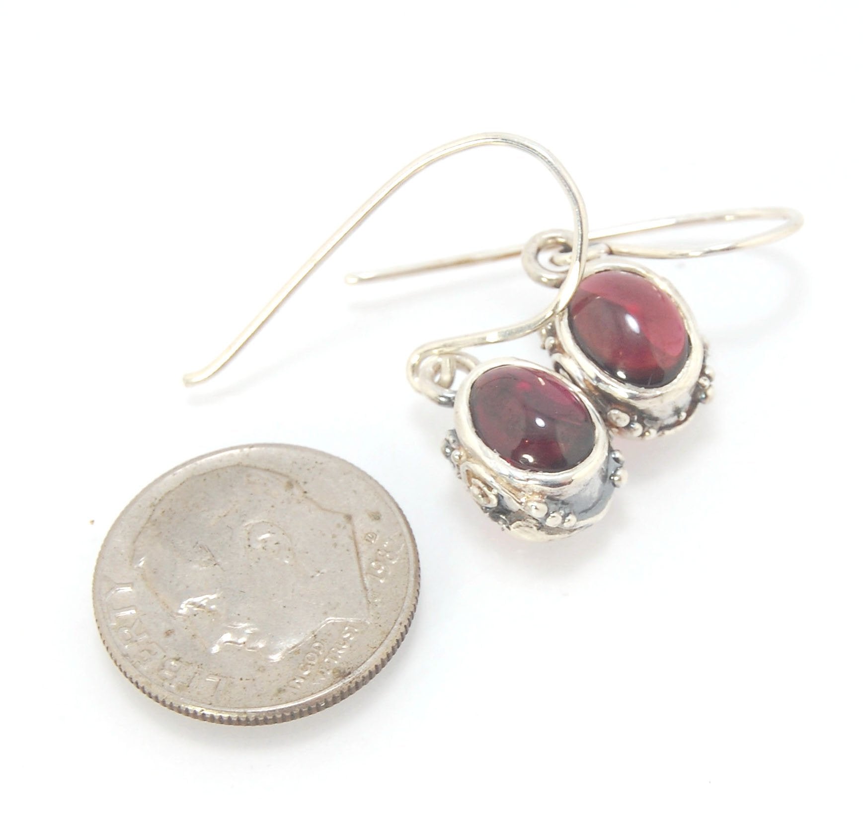 Oval Swirled Earrings with French Hooks in Sterling with your choice of Moonstone, Blue Chacedony, Amethyst, Rose Quartz, or Garnet These sweet swirled oval dangle earrings can be set with the stone of your choice: Moonstone, Blue Chacedony, Amethyst, Ros