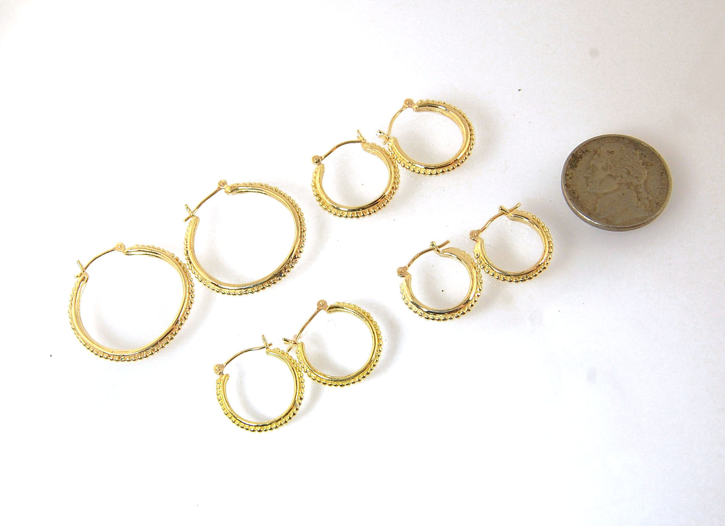 Light Etruscan Hoops in 14k gold - 15mm - lightweight These 14k yellow gold hoops are cast in my studio (actually on the deck as casting needs good ventilation) from a granulated master for a limited edition series of hoops. I use fine silver for the orig