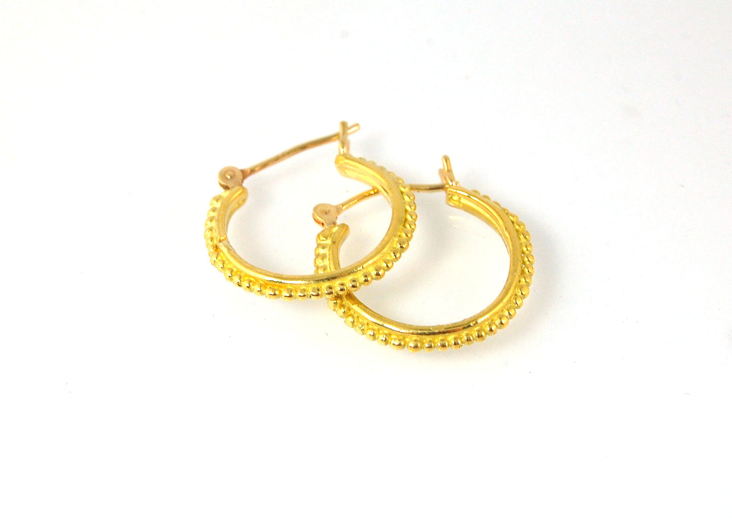 Light Etruscan Hoops in 14k gold - 15mm - lightweight These 14k yellow gold hoops are cast in my studio (actually on the deck as casting needs good ventilation) from a granulated master for a limited edition series of hoops. I use fine silver for the orig