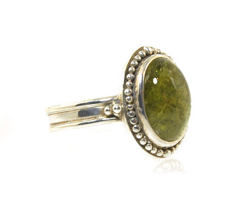 Green Tourmaline Fine Silver Granulation Ring- size 9 Granulation is a controlled fusing process that has been utilized for thousands of years. This unique surface will get more interesting with wear. The granules are individually placed and fused with a