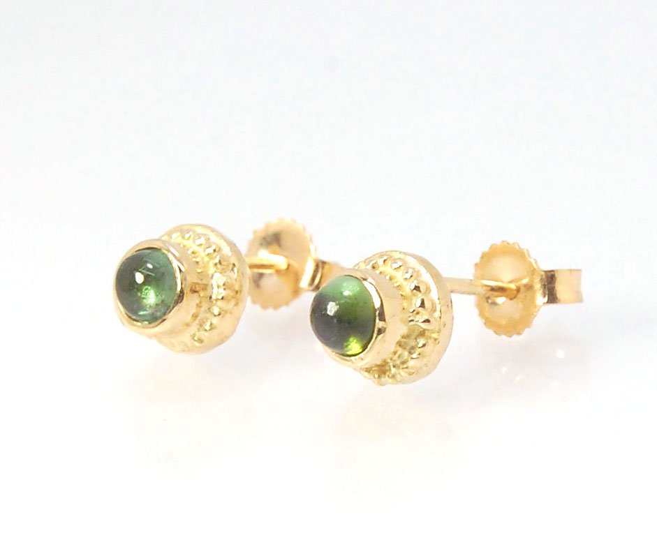 Green Tourmaline Classic Cast Granulation Studs in 14k These are tiny bezel settings I created using the ancient process of granulation. Then I made a mold of it and injected the mold with wax and used that wax to create a 14k gold version of these granul