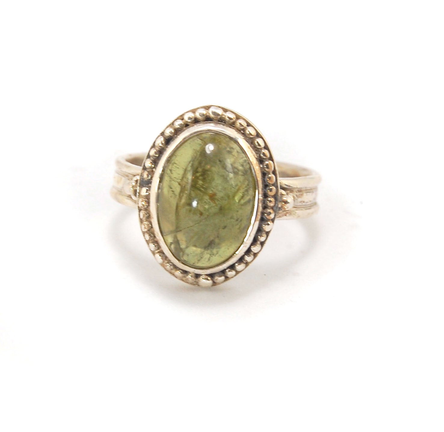 Green Tourmaline Fine Silver Granulation Ring- size 9 Granulation is a controlled fusing process that has been utilized for thousands of years. This unique surface will get more interesting with wear. The granules are individually placed and fused with a