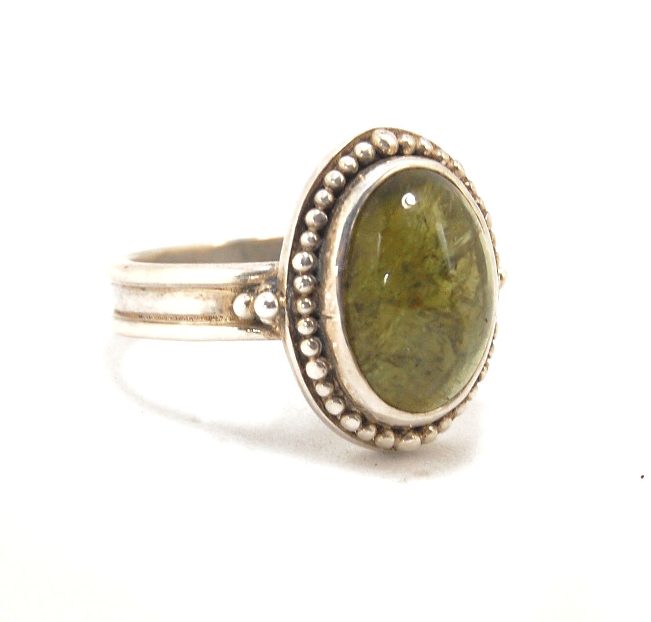 Green Tourmaline Fine Silver Granulation Ring- size 9 Granulation is a controlled fusing process that has been utilized for thousands of years. This unique surface will get more interesting with wear. The granules are individually placed and fused with a