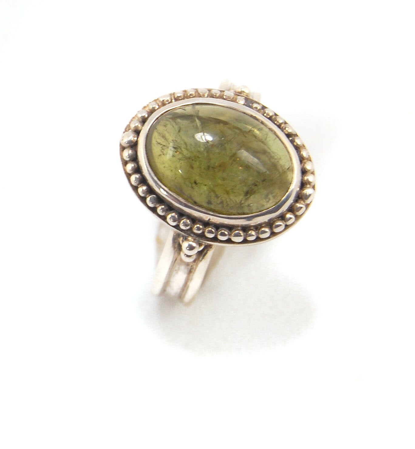 Green Tourmaline Fine Silver Granulation Ring- size 9 Granulation is a controlled fusing process that has been utilized for thousands of years. This unique surface will get more interesting with wear. The granules are individually placed and fused with a