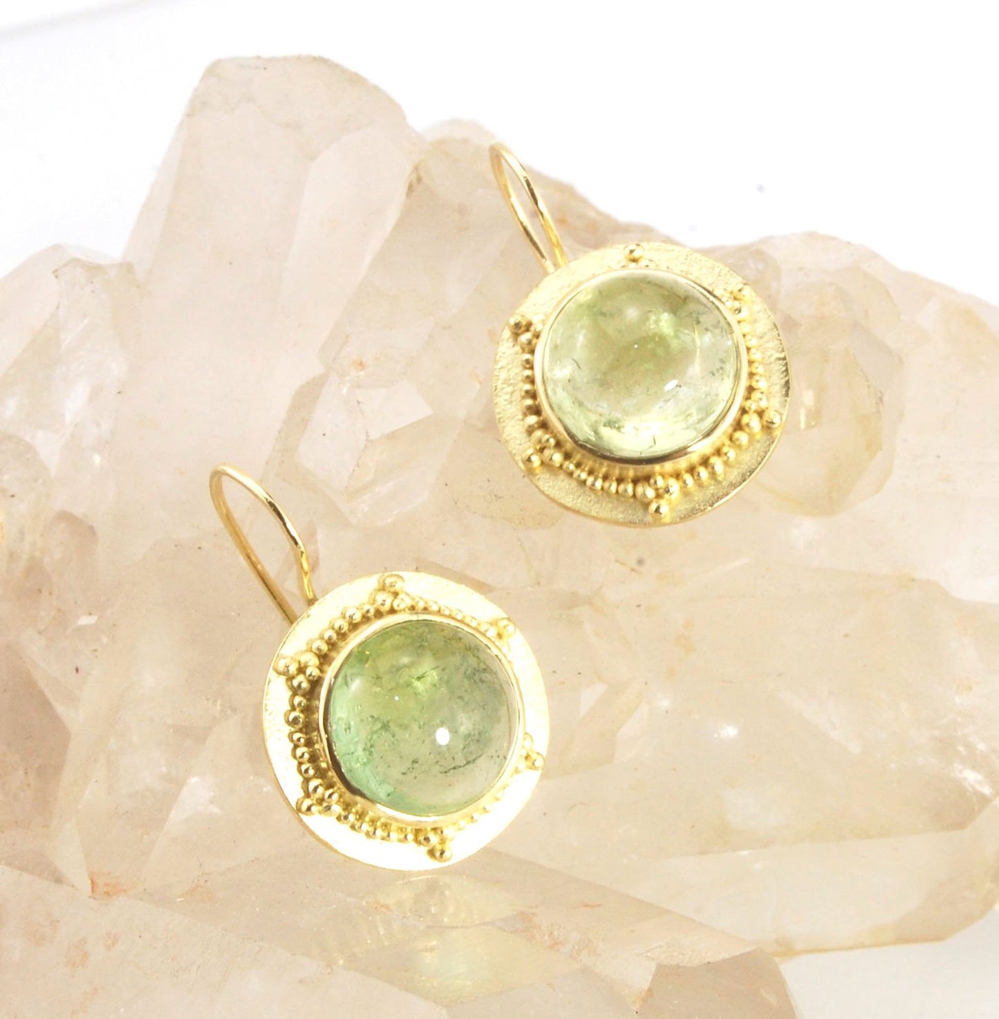 Green Bi-color Tourmaline 18k Gold Granulation Earrings These Green Bi-color Tourmaline 18k Gold Granulation Earrings are Classically-inspired 18k granulation. With 2 luminous and clear bi-color tourmaline cabochons bezel-set in 18k an accented ring of 18