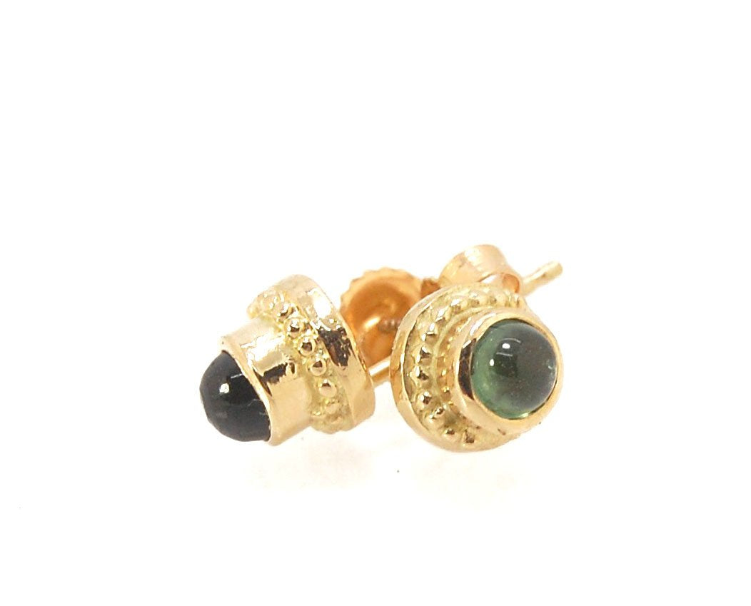 Green Tourmaline Classic Cast Granulation Studs in 14k These are tiny bezel settings I created using the ancient process of granulation. Then I made a mold of it and injected the mold with wax and used that wax to create a 14k gold version of these granul