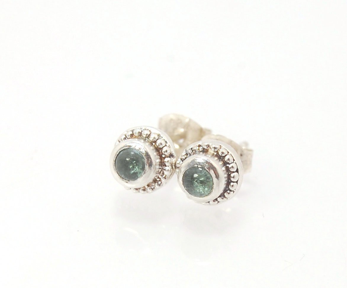 BlueGreen Tourmaline Tiny Post Earrings in Sterling Silver These are tiny bezel settings I created using the ancient process of granulation. Then I made a mold of it and injected the mold with wax and used that wax to create a Sterling Silver version of t