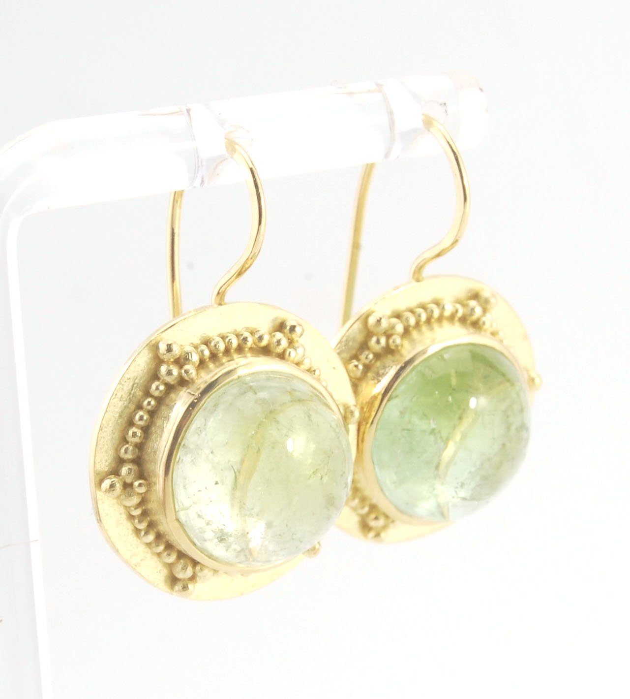 Green Bi-color Tourmaline 18k Gold Granulation Earrings These Green Bi-color Tourmaline 18k Gold Granulation Earrings are Classically-inspired 18k granulation. With 2 luminous and clear bi-color tourmaline cabochons bezel-set in 18k an accented ring of 18