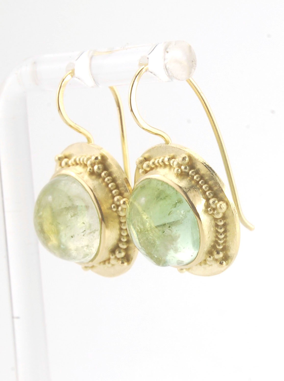 Green Bi-color Tourmaline 18k Gold Granulation Earrings These Green Bi-color Tourmaline 18k Gold Granulation Earrings are Classically-inspired 18k granulation. With 2 luminous and clear bi-color tourmaline cabochons bezel-set in 18k an accented ring of 18