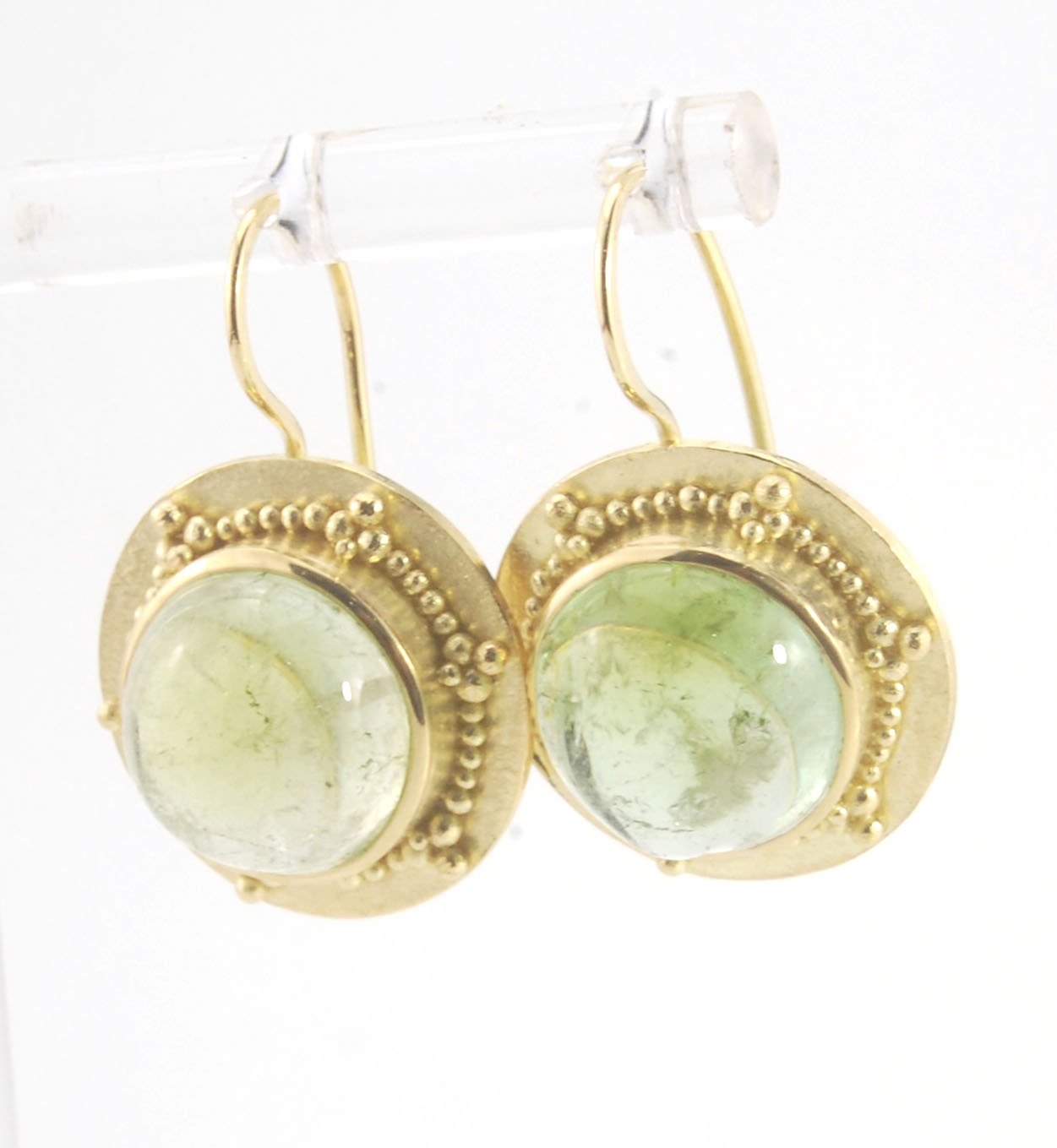 Green Bi-color Tourmaline 18k Gold Granulation Earrings These Green Bi-color Tourmaline 18k Gold Granulation Earrings are Classically-inspired 18k granulation. With 2 luminous and clear bi-color tourmaline cabochons bezel-set in 18k an accented ring of 18