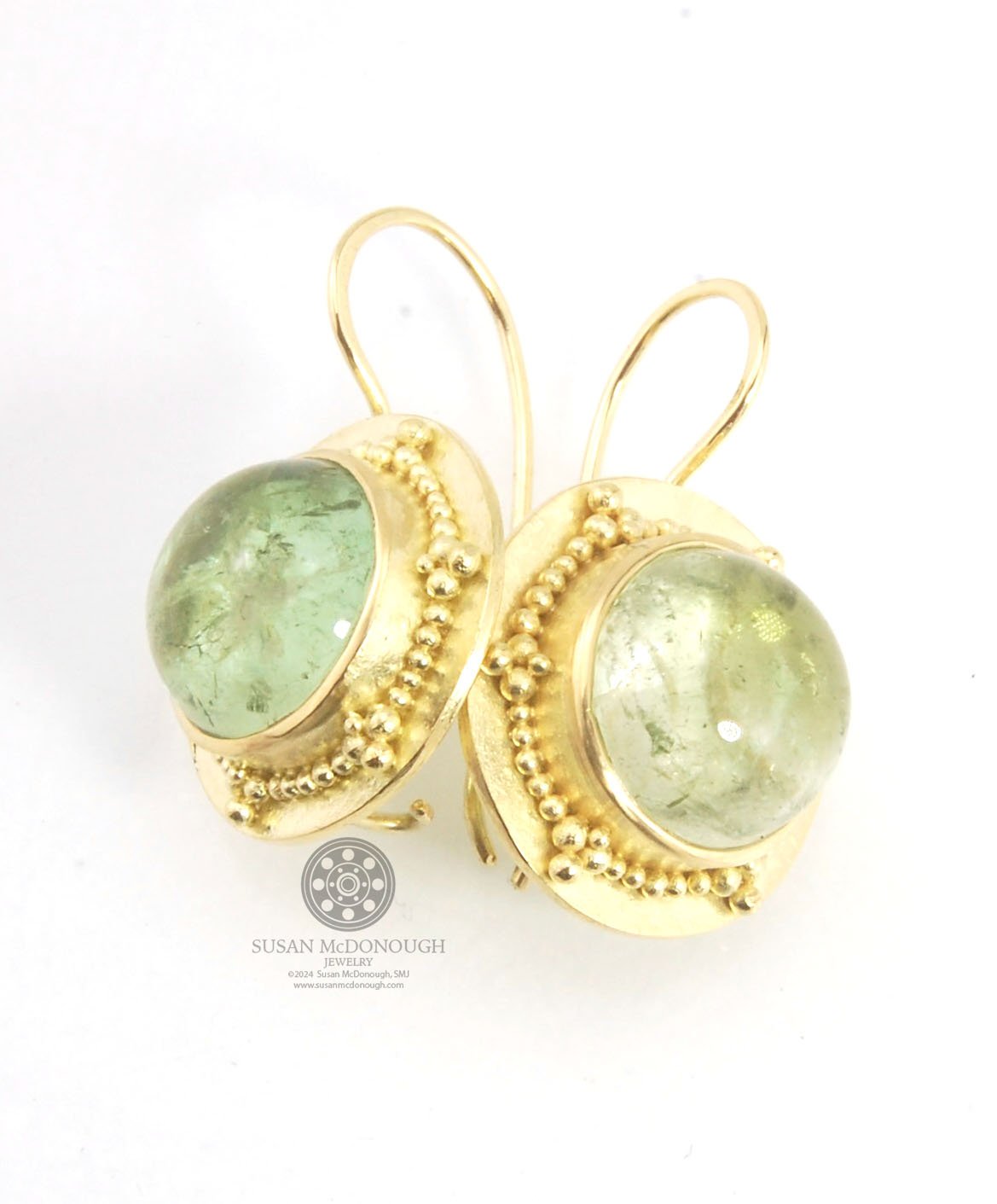 Green Bi-color Tourmaline 18k Gold Granulation Earrings These Green Bi-color Tourmaline 18k Gold Granulation Earrings are Classically-inspired 18k granulation. With 2 luminous and clear bi-color tourmaline cabochons bezel-set in 18k an accented ring of 18