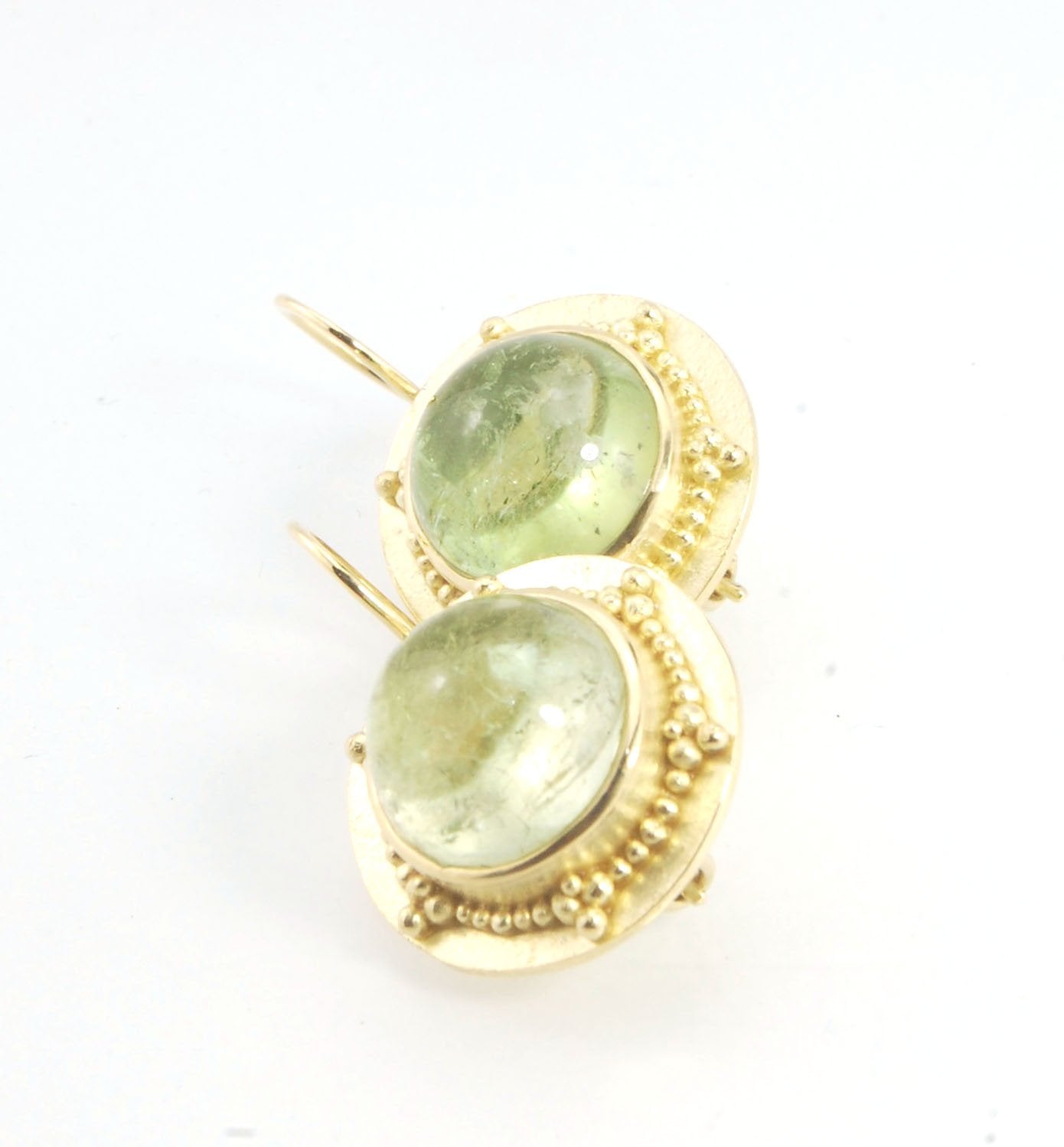 Green Bi-color Tourmaline 18k Gold Granulation Earrings These Green Bi-color Tourmaline 18k Gold Granulation Earrings are Classically-inspired 18k granulation. With 2 luminous and clear bi-color tourmaline cabochons bezel-set in 18k an accented ring of 18