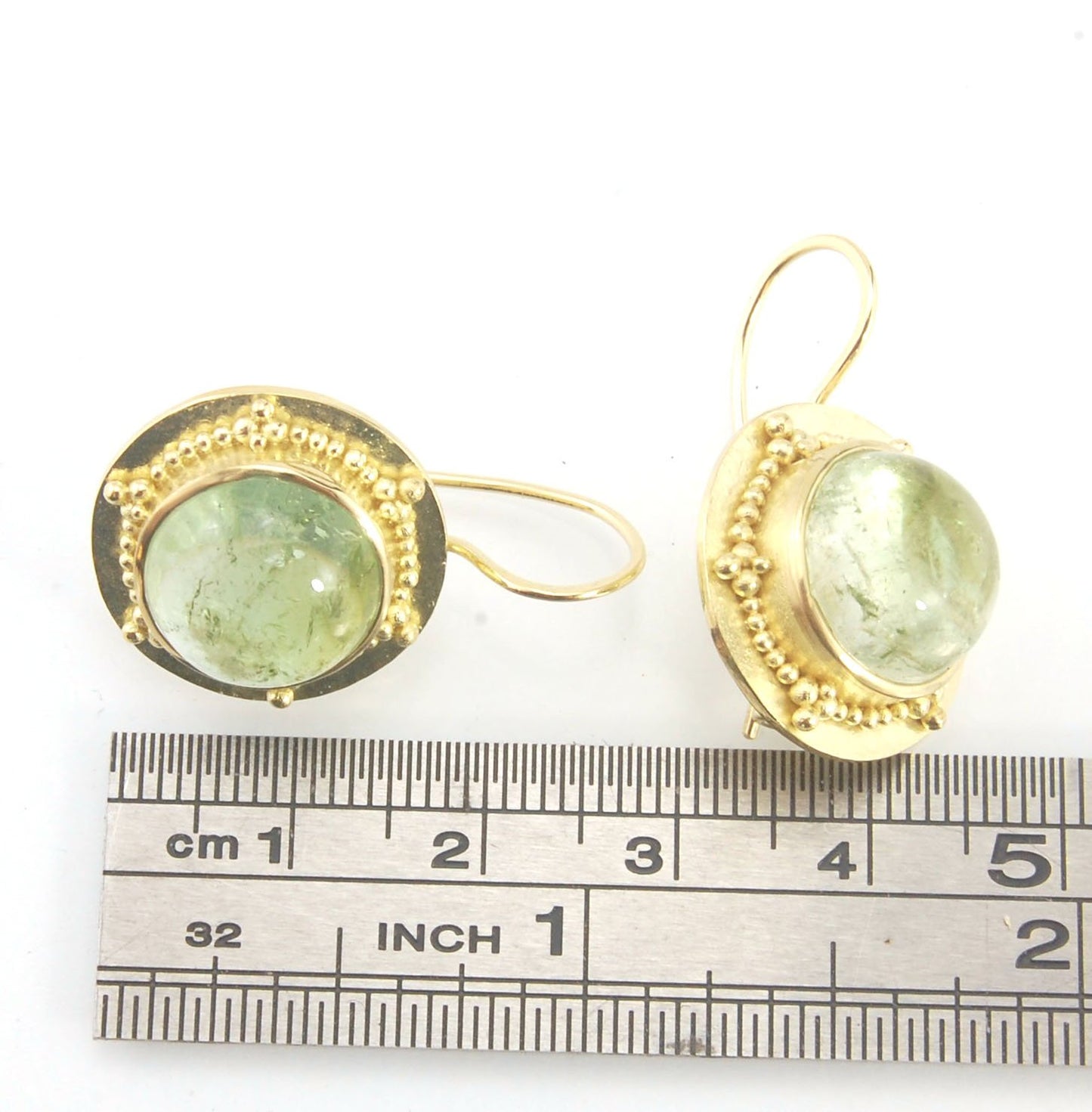 Green Bi-color Tourmaline 18k Gold Granulation Earrings These Green Bi-color Tourmaline 18k Gold Granulation Earrings are Classically-inspired 18k granulation. With 2 luminous and clear bi-color tourmaline cabochons bezel-set in 18k an accented ring of 18