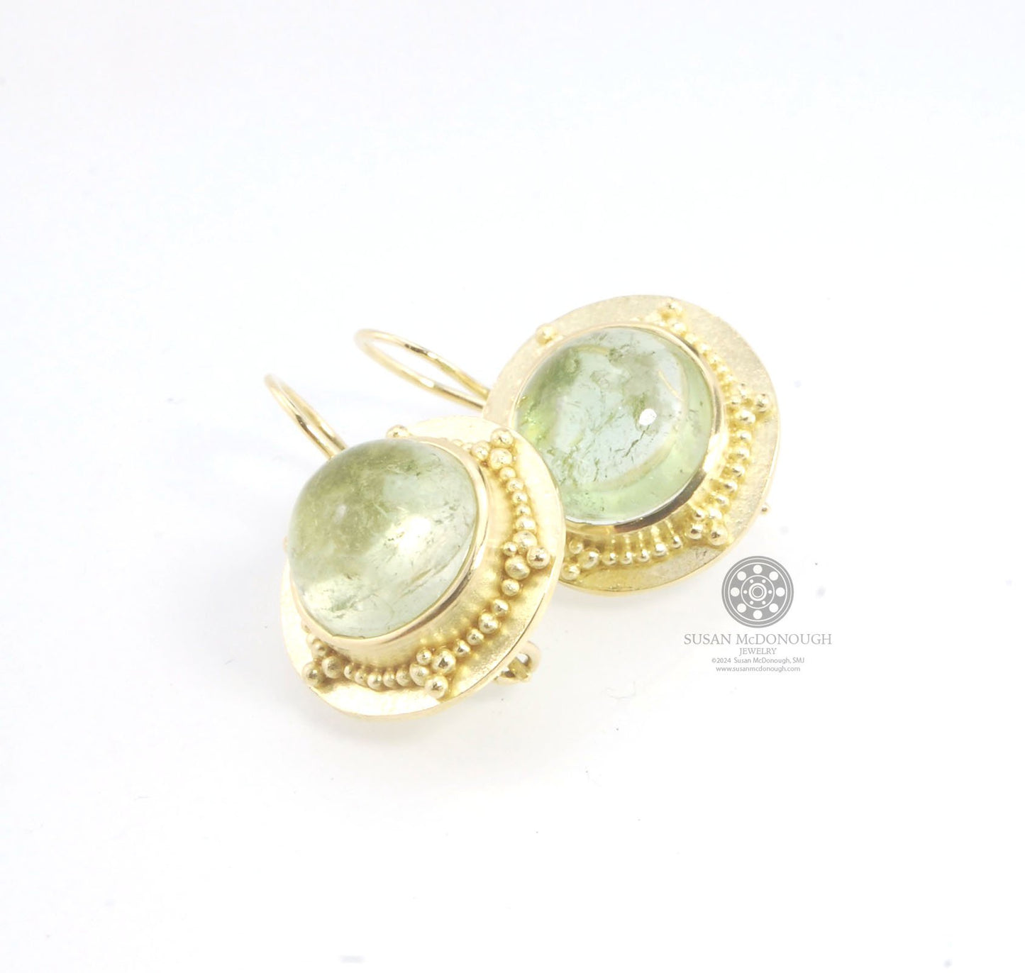 Green Bi-color Tourmaline 18k Gold Granulation Earrings These Green Bi-color Tourmaline 18k Gold Granulation Earrings are Classically-inspired 18k granulation. With 2 luminous and clear bi-color tourmaline cabochons bezel-set in 18k an accented ring of 18