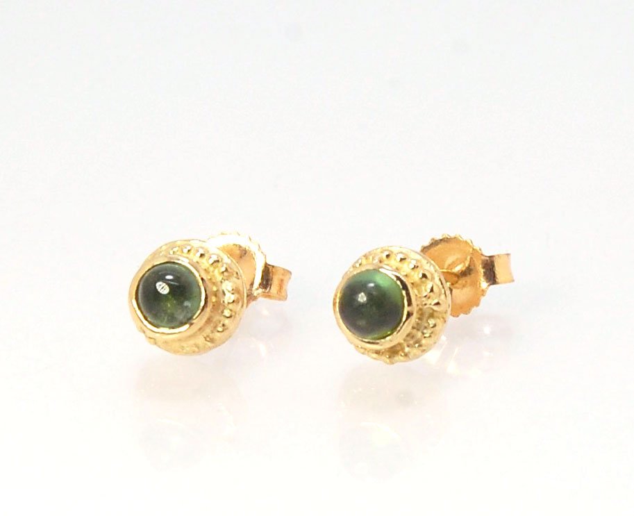 Green Tourmaline Classic Cast Granulation Studs in 14k These are tiny bezel settings I created using the ancient process of granulation. Then I made a mold of it and injected the mold with wax and used that wax to create a 14k gold version of these granul