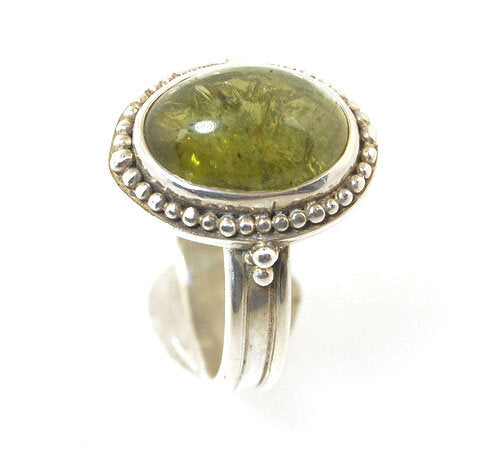 Green Tourmaline Fine Silver Granulation Ring- size 9 Granulation is a controlled fusing process that has been utilized for thousands of years. This unique surface will get more interesting with wear. The granules are individually placed and fused with a