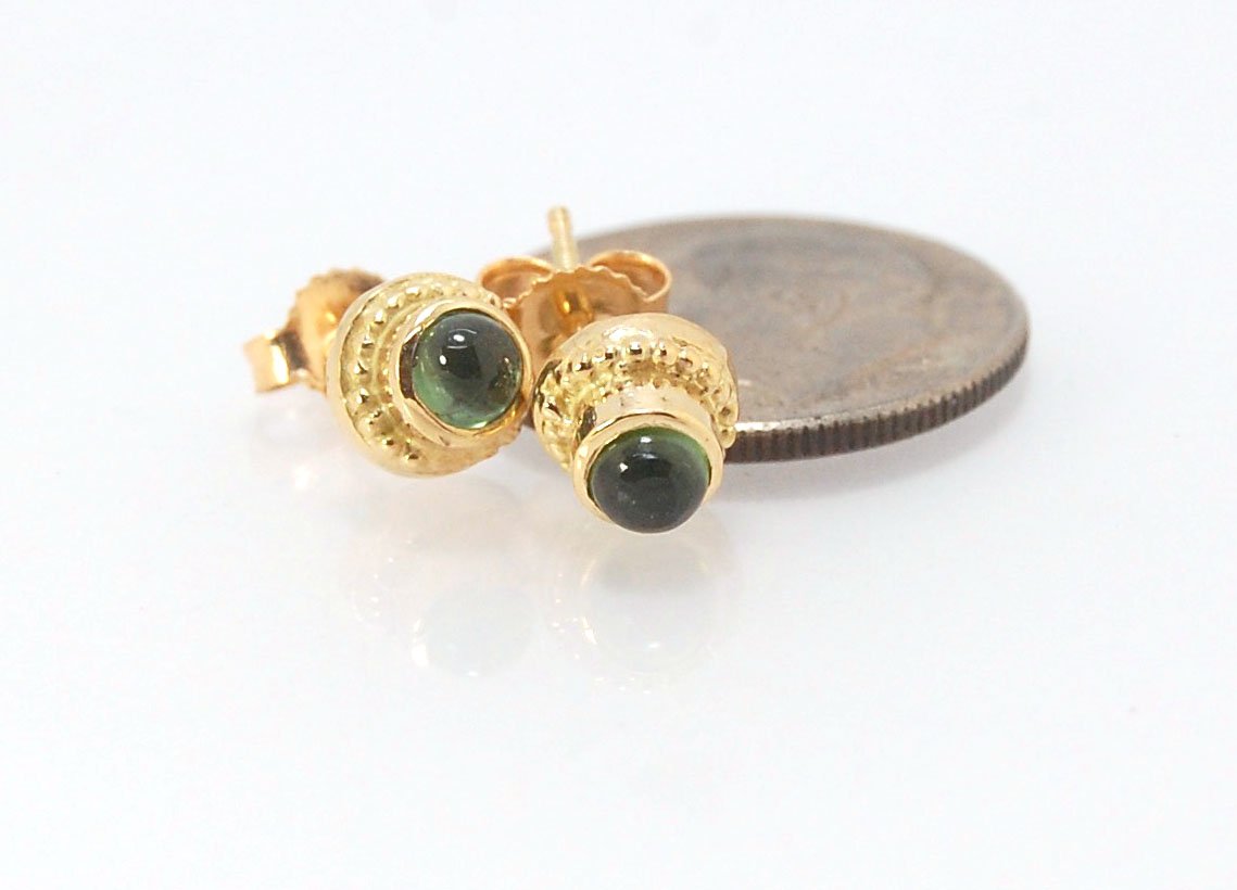 Green Tourmaline Classic Cast Granulation Studs in 14k These are tiny bezel settings I created using the ancient process of granulation. Then I made a mold of it and injected the mold with wax and used that wax to create a 14k gold version of these granul