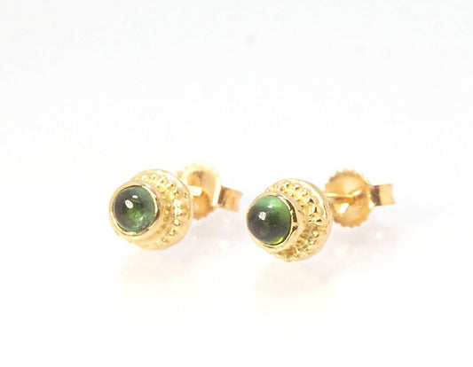 Green Tourmaline Classic Cast Granulation Studs in 14k These are tiny bezel settings I created using the ancient process of granulation. Then I made a mold of it and injected the mold with wax and used that wax to create a 14k gold version of these granul