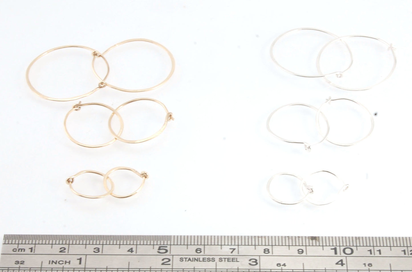 Hammered 14k Hoops - Small, Medium and Large These are exactly the same as my hammered sterling hoops, but they are made of solid 14k gold! They are super lightweight, classic wire hammered hoops you can sleep and live in. These delicate hoops are forged