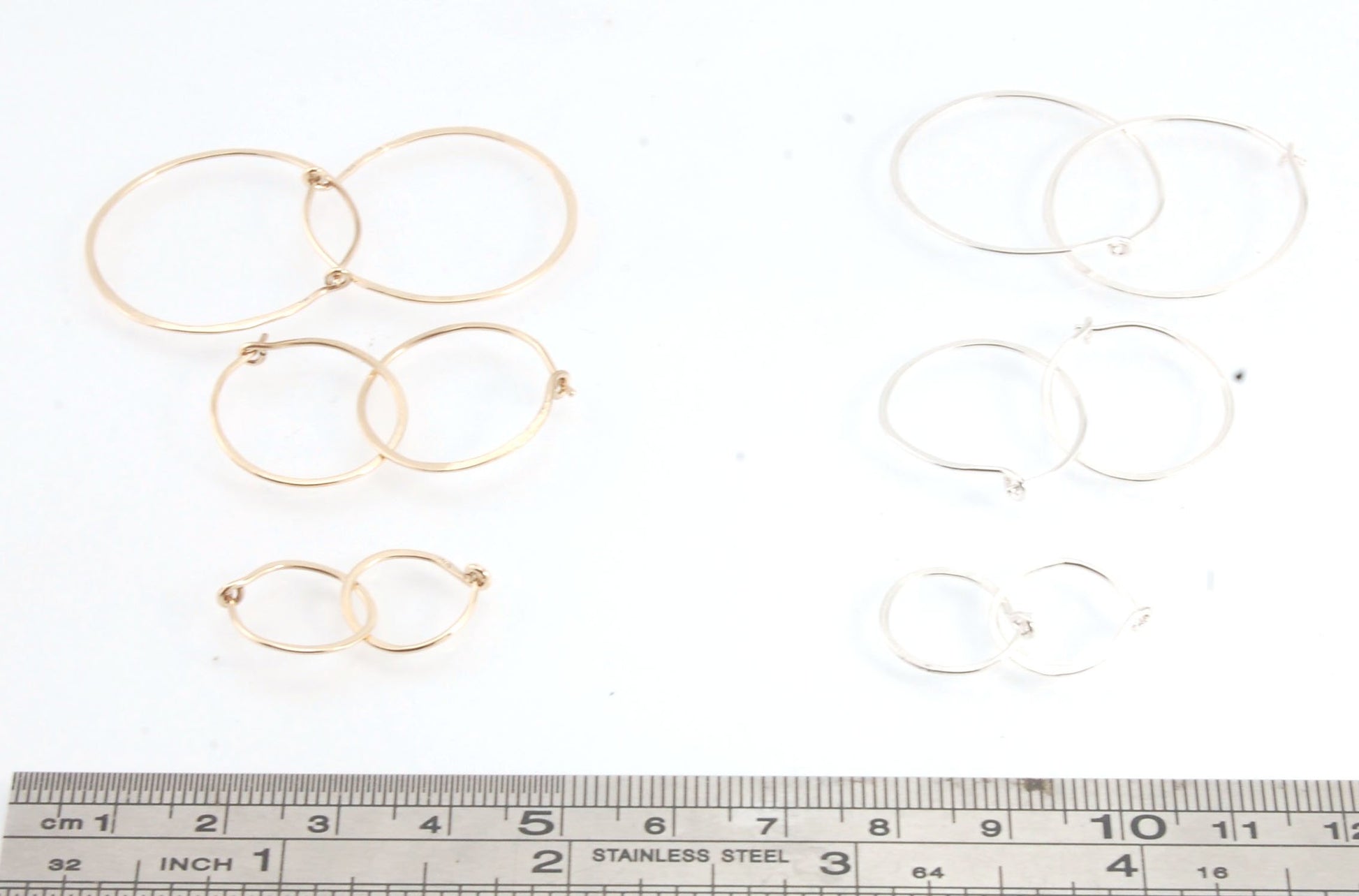 Hammered 14k Hoops - Small, Medium and Large These are exactly the same as my hammered sterling hoops, but they are made of solid 14k gold! They are super lightweight, classic wire hammered hoops you can sleep and live in. These delicate hoops are forged