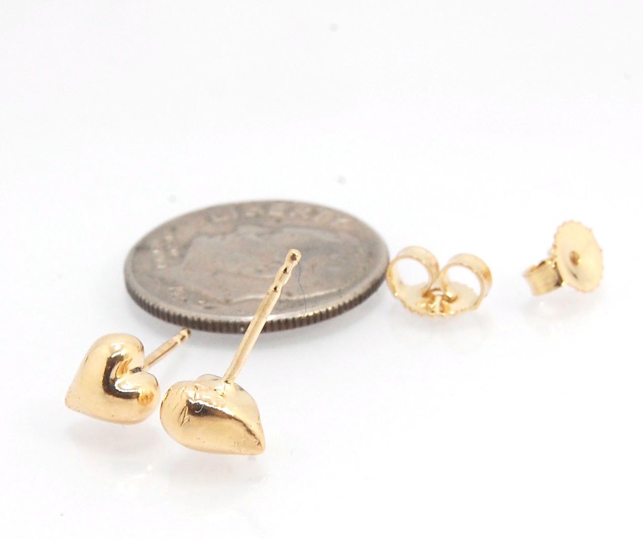 OMG Puffy Heart Post Earrings in 14k Gold or Sterling Silver OMG! These puffy heart earrings are so sweet! I carved this little guy in wax and have been casting them all week in both silver and gold.Choose a pair of tiny solid puffy hearts cast in 14k gol