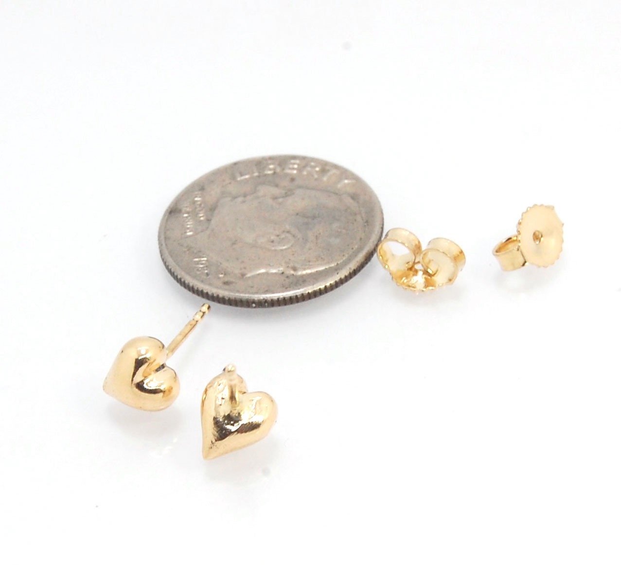 OMG Puffy Heart Post Earrings in 14k Gold or Sterling Silver OMG! These puffy heart earrings are so sweet! I carved this little guy in wax and have been casting them all week in both silver and gold.Choose a pair of tiny solid puffy hearts cast in 14k gol