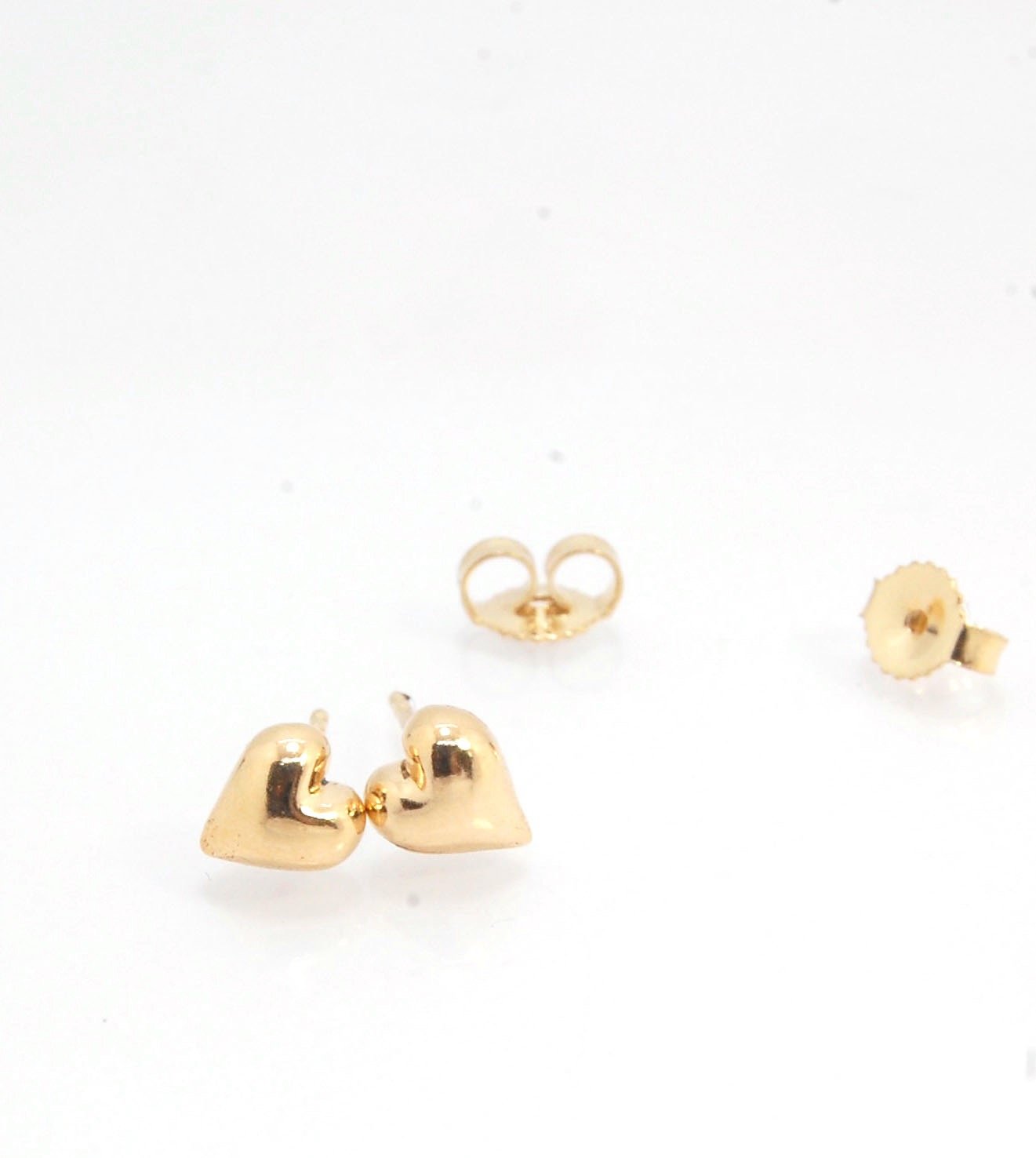 OMG Puffy Heart Post Earrings in 14k Gold or Sterling Silver OMG! These puffy heart earrings are so sweet! I carved this little guy in wax and have been casting them all week in both silver and gold.Choose a pair of tiny solid puffy hearts cast in 14k gol