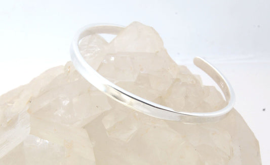 Solid Cuff Bracelet - Sterling SIlver This is a heavy, solid, sterling silver cuff with a brushed finish. A staple of any collection! This cuff bracelet has a nice weight and feels good on.First I pour an ingot of sterling silver, then I roll it out to a