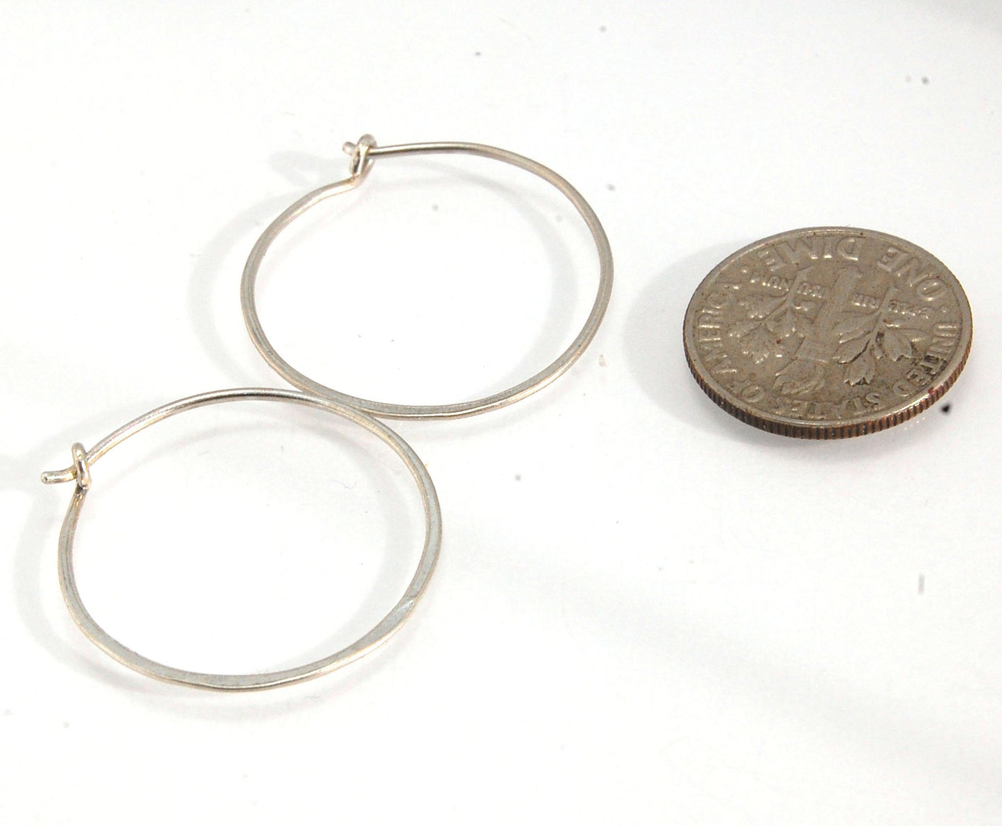 Hammered Hoops - Sterling - Small, Medium and Large Looking for an affordable handmade gift? Or some super lightweight Sterling Silver Hoops you can live in? These classic wire hammered hoops you can sleep and live in are forged from 20 gage Sterling wire