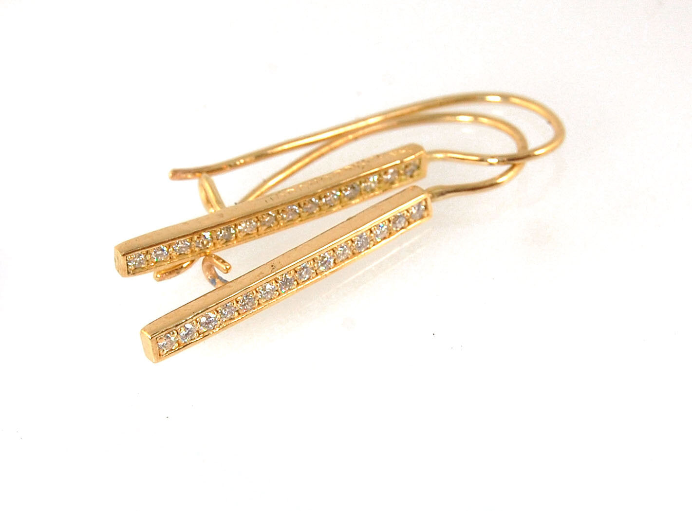 Long Diamond Earrings with french hook and clasp - 14k yellow gold These great little sparklers are subtle enough for every day as long as you don’t mind everyone noticing! They have 14 x 1.3mm colorless diamonds in a single pave row. Earrings have a fren