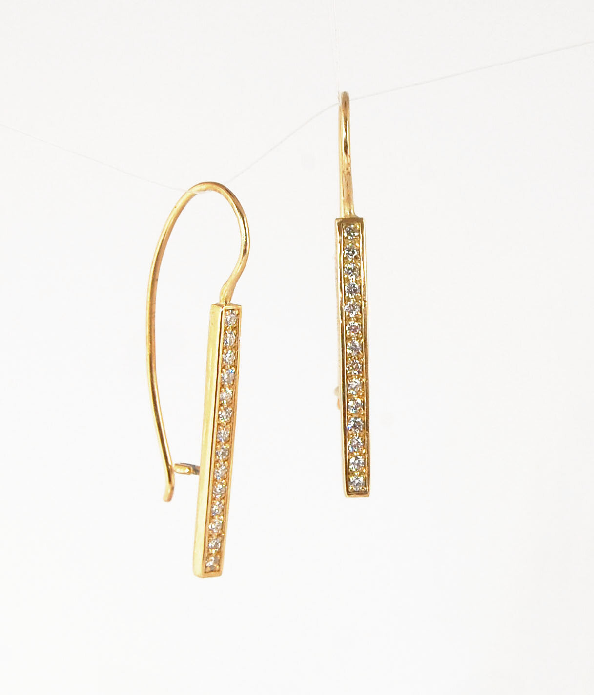 Long Diamond Earrings with french hook and clasp - 14k yellow gold These great little sparklers are subtle enough for every day as long as you don’t mind everyone noticing! They have 14 x 1.3mm colorless diamonds in a single pave row. Earrings have a fren