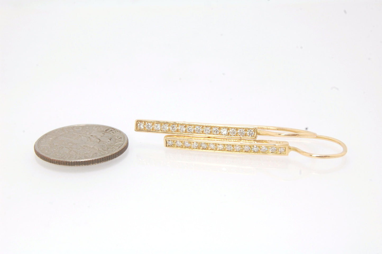 Long Diamond Earrings with french hook and clasp - 14k yellow gold These great little sparklers are subtle enough for every day as long as you don’t mind everyone noticing! They have 14 x 1.3mm colorless diamonds in a single pave row. Earrings have a fren