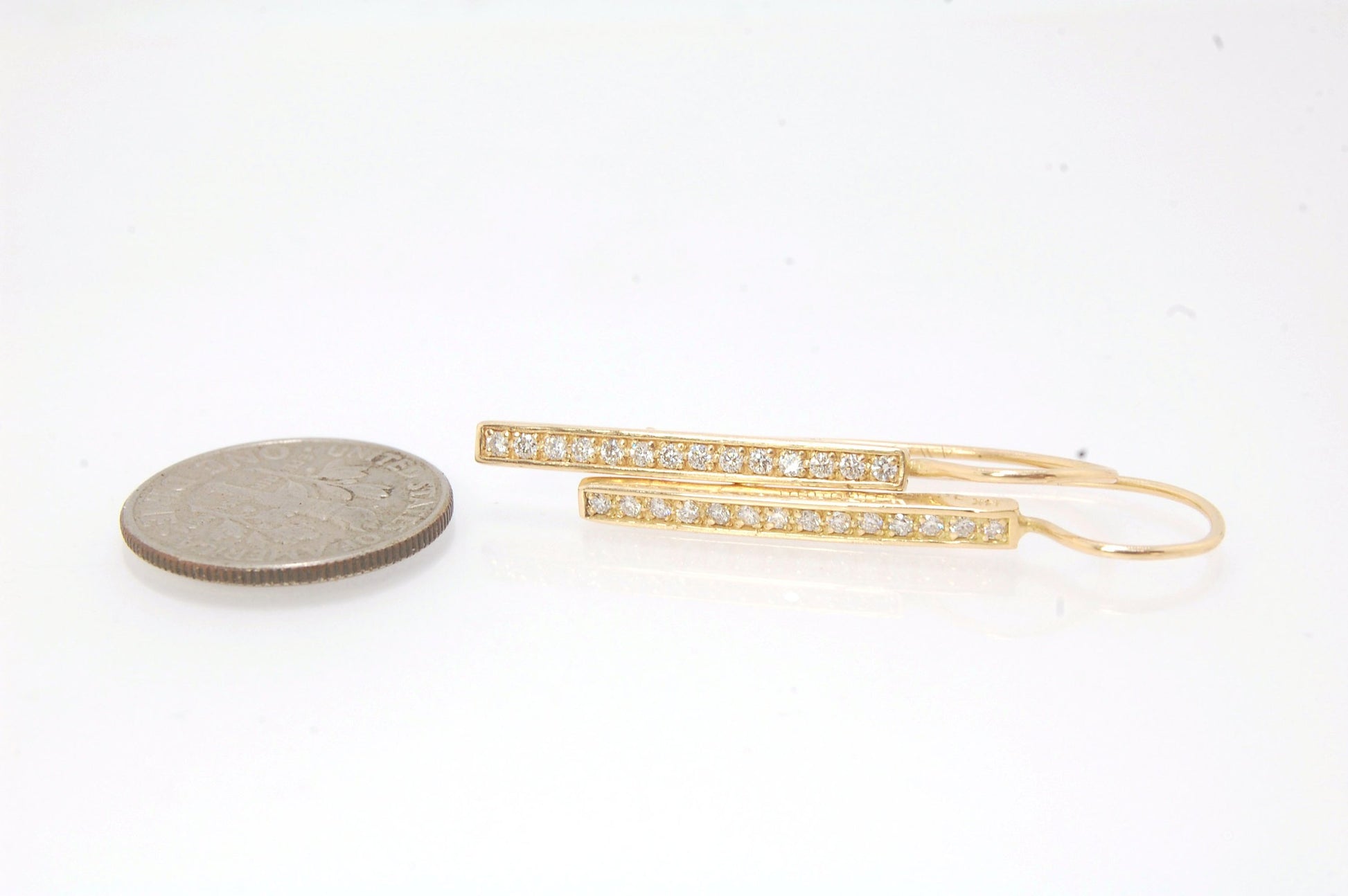 Long Diamond Earrings with french hook and clasp - 14k yellow gold These great little sparklers are subtle enough for every day as long as you don’t mind everyone noticing! They have 14 x 1.3mm colorless diamonds in a single pave row. Earrings have a fren